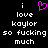 Black background with white pixelated text reading "i love kaylor so fucking much" and a pink heart symbol above the first 'i'.