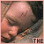 showing a person's face with closed eyes and visible forehead marks, overlaid with text fragments