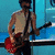 Pixelated image of a person with curly hair and a red electric guitar against blue background, paired with purple text reading 'I Love rickjona' on white.