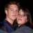 Pixelated image of two people embracing against black background with white text reading 'Kelsey + Brett' on right side.