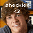 Pixelated image of a person with brown curly hair wearing dark clothing, overlaid with white text reading 'sheckler' and a heart symbol.