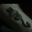 A split image shows a dark, pixelated tattoo on the left and pixelated text on the right reading "A spot that never comes off" in black on white.