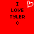 Red background with black text reading "I LOVE TYLER :" and a white pixelated heart symbol above the text.