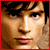 A 3x2 contact sheet of six pixelated character portraits from the TV show Smallville, with a red banner displaying "Smallville" text on the right side.