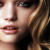 Close-up of a person's face with light brown hair, visible teeth, and a neutral expression, cropped to show only the lower half of the face.
