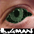 A pixelated close-up of a human eye with green irises and a black pupil, set against light brown skin tones, with white text in a stylized font at the bottom.