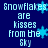 Blue background with light blue pixelated text reading "Snowflakes are kisses from the Sky" and multiple light blue snowflake symbols scattered across.
