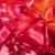 A static pixelated image composed of red and orange hues with no discernible subjects or text.