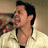 Pixelated image of a person in a light-colored collared shirt with text reading What The Hell? on the right side.