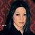 A 50x50 pixel buddy icon split into two sections: a left-side portrait of a person with long dark hair against a red patterned background, and a right-side green section with bright green text reading "Original Icons .com".