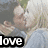 Two people kiss in a grassy outdoor setting; one wears a blue hoodie with 'love' text and red heart symbol, the other has light hair.