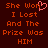 Dark red background with orange pixelated text reading "She Won I Lost And The Prize Was HIM" and a pink heart symbol replacing the 'o' in "Won".