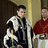 Two historical figures in period clothing stand beside a blue background with text reading 'JRM In The Tudors' on the right.
