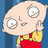 Pixelated cartoon character with large eyes and a bald head, wearing red overalls and yellow shirt against blue background.