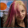 A woman with pink and blonde hair in a clothing store background, wearing black strappy top and blue jeans, making various poses including smiling, hand gestures, and turning.