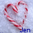 A pixelated heart-shaped candy cane with red and white stripes on a light blue background, with the text 'Jen' in blue at the bottom right.