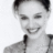 Static grayscale buddy icon of a person with short dark hair, visible facial features including eyes and mouth, wearing a collared shirt or jacket against a plain background.