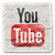 Pixelated YouTube icon with "You" text above red "Tube" button on light gray background