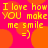 A static image with bright pink background and orange circular shapes, displaying yellow pixelated text reading "I love how YOU make me smile =)" in four repeated sections.