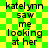 Green and yellow checkered background with repeated text 'katel ynn saw me looking at her' in black pixelated font across two identical vertical sections.