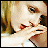 pixelated images showing a person with blonde hair and red lips, with yellow text overlays changing across frames