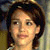 Static pixelated image of a person with dark hair, light skin tone, and neutral expression against blurred background.