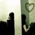 Animated sequence showing silhouettes of two figures against a striped background with heart symbols, displaying changing blue text overlays.