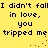 Yellow background with black text repeating "I didn't fall in love, you tripped me" and red pixel dots forming a trail.