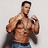 A pixelated image of a shirtless man with dark hair and blue jeans holding a dark jacket, standing against a light background with red text on the right.