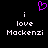 Purple pixelated heart symbol above white text reading 'i love Mackenzi' on black background.