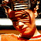 repeated cartoon-style character faces with striped headgear, orange skin tones, and red-and-white clothing against a black-and-white striped background