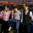 Pixelated image of three figures in motion on left, bright pink background with blue text 'I Love the Jonas Brothers' on right.