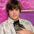 Pixelated image of a person holding a cat against a pink and purple background with pink text reading "I Luv Zac Efron! Who Wouldn't".