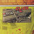 Pixelated image with yellow border, central dark rectangular area, and red pixel clusters above it on a gradient background.