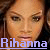 Pixelated close-up of a person's face with brown hair, overlaid by light purple text reading 'Rihanna' at the bottom.