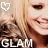 A pixelated close-up of a smiling person with blonde hair, featuring two heart symbols and the text 'GLAM' at the bottom.