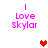 Pixelated text 'Love Skylar' in pink with vertical lines above, accompanied by a red heart and a light pink heart on white background.