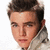 A person with short brown hair and light skin wears a white hooded garment against a plain background, shown in three distinct pixelated views.