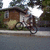 Pixelated outdoor scene with a bicycle and house on left, red background with yellow text 'ahh fun times!!' on right.