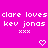 Pixelated text and heart symbols repeat across a bright pink background with partial gray overlay on the right edge.