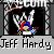 Pixelated static icon showing a wrestling character in colorful attire inside a dark arena frame with text below.