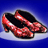 Pixelated red high-heeled shoes with black accents on a blue gradient background.