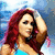 A four- shows a person with long red hair wearing a blue crop top and denim shorts, posing in different angles against a blurred background