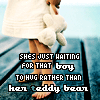 A child in a white dress holding a white teddy bear stands on a wooden pier with text overlaid reading "SHE'S JUST WAITING FOR THAT BOY TO HUG RATHER THAN HER TEDDY BEAR".