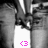 A grayscale image with a central white vertical strip containing a pink pixelated symbol resembling '<3' at the bottom.