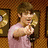 A 4-frame contact sheet of a male celebrity in different outfits and poses against a wall with framed gold records, displayed as an animated AIM buddy icon.