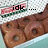 A four- of pixelated donuts in a box with changing text overlays