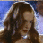A 48x48 pixel animated buddy icon featuring a woman with long brown hair and red lipstick on the left, transitioning to bold text "MOULIN ROUGE!" in large red letters on a beige background on the right.
