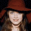 A four- shows a person in a red hat with varying facial expressions and a blue with a red heart containing the text ALEXIS