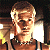 A pixelated contact sheet showing two frames of an animated icon featuring a person with light hair and a necklace on the left, next to green text reading "Original Icons .com" on a dark background.